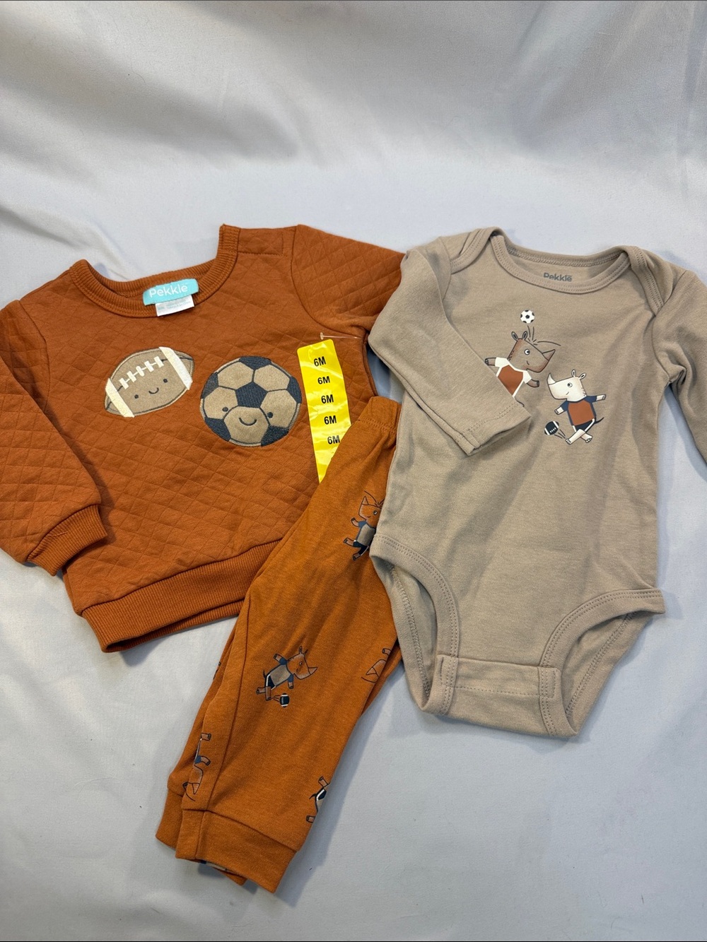 Pekkie Rust Orange Quilted Top with Tan Soccer Animal Bodysuit Set - Kids